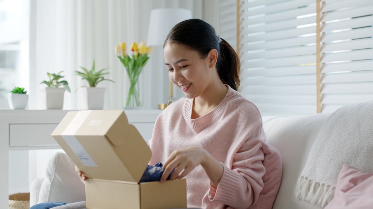 Woman smiling when receiving a package