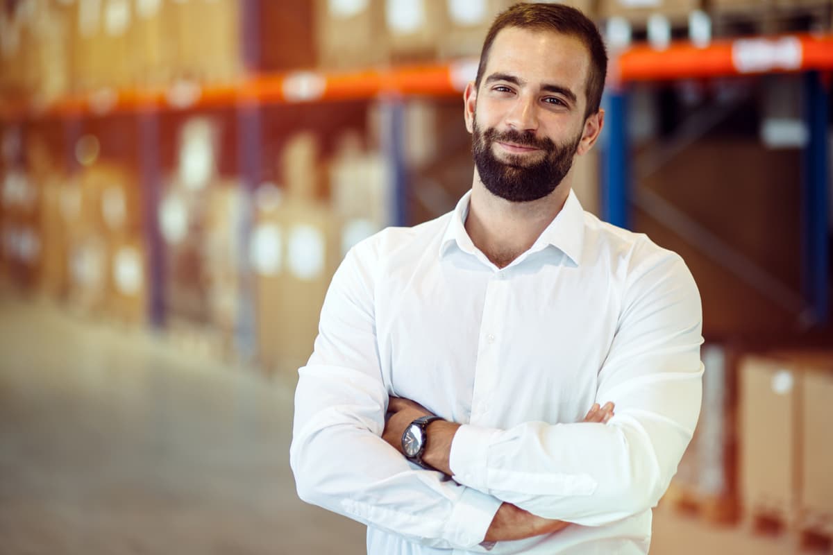 Logistics manager posing in a warehouse