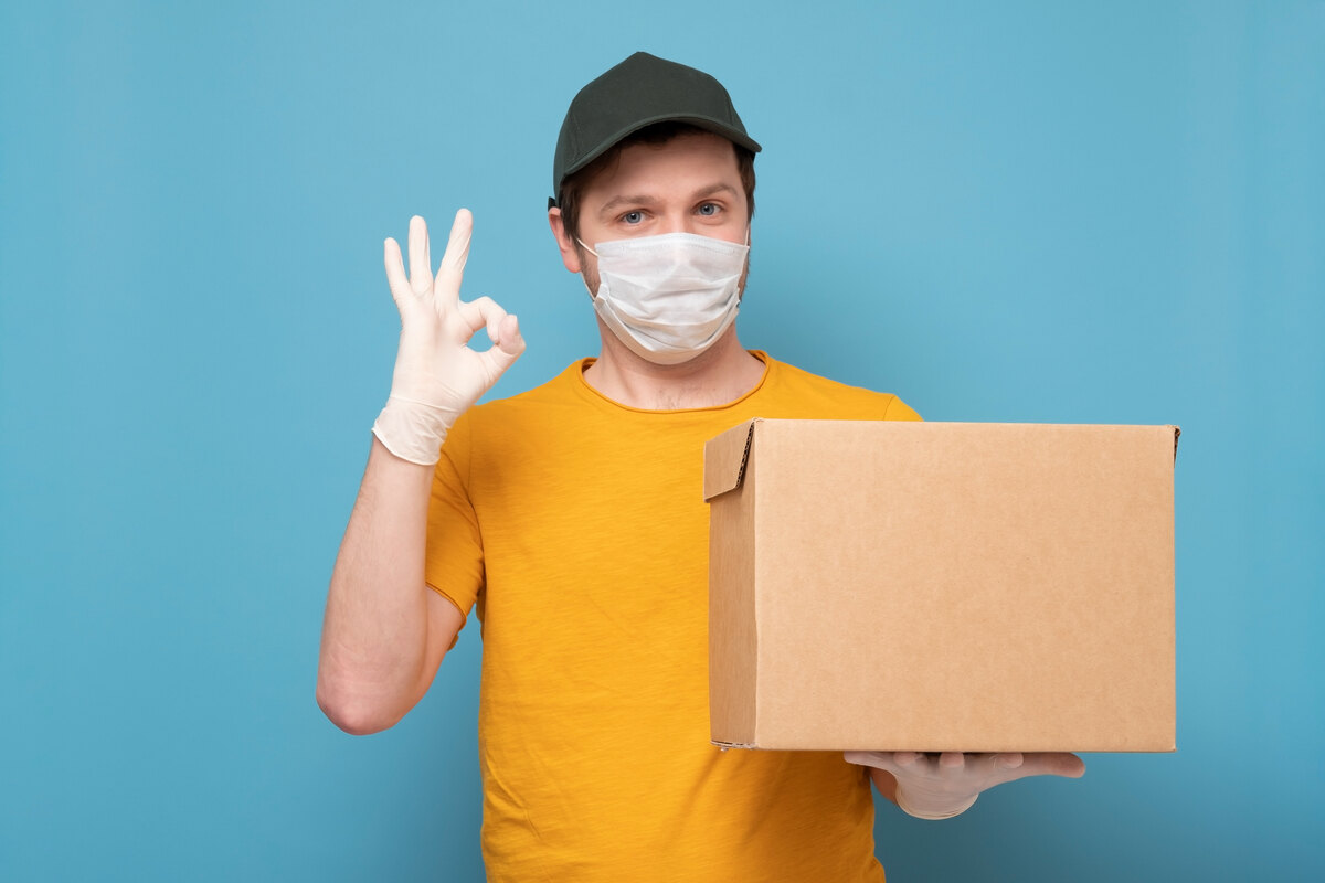 Man holding a package with medical supplies