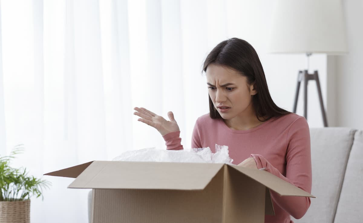 Girl receiving a package with broken products